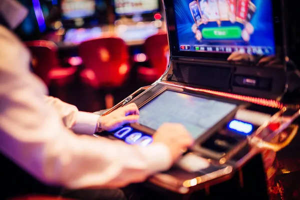 A young woman relaxing with her phone while dynamic casino elements float around her, illustrating the smooth mobile experience offered by the HOKI678 app.