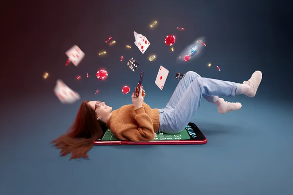 A glamorous woman holding casino chips in a neon-lit environment, representing the premium online casino atmosphere of HOKI678.